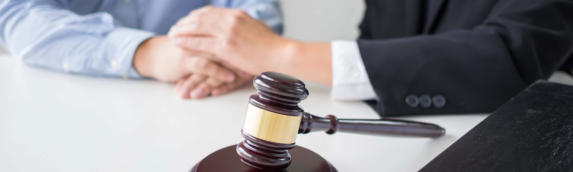 Judge gavel with lawyers advice legal at law firm in background. Concepts of law services