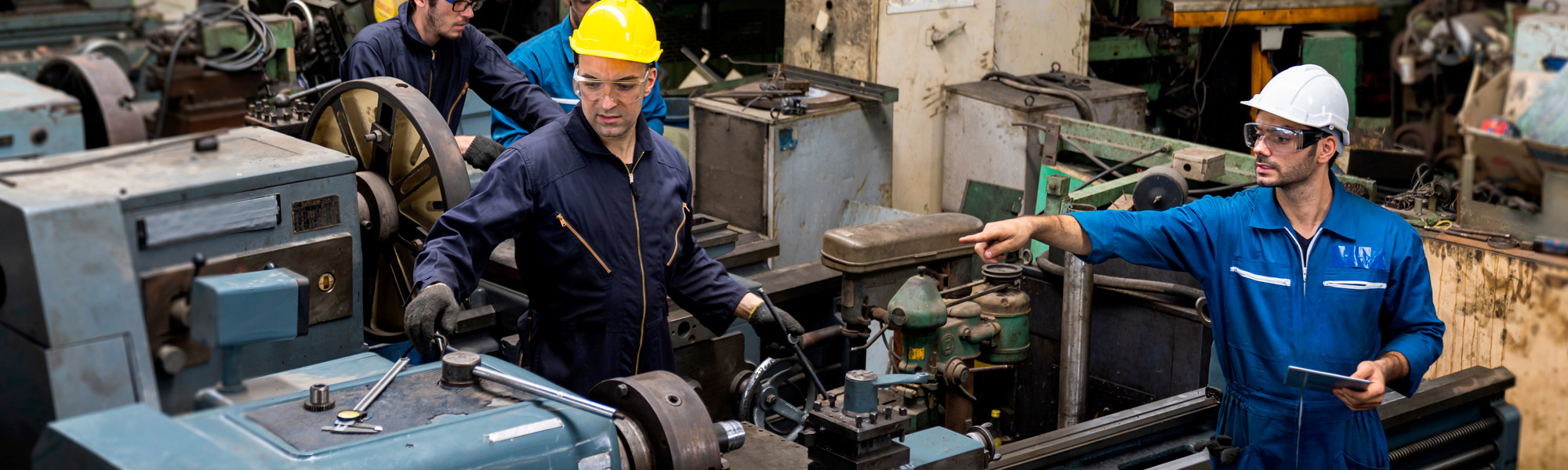 Technicians are working on industrial machines