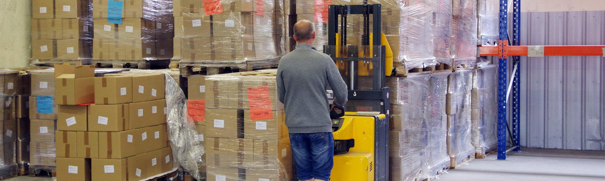 man loading boxes on to truck