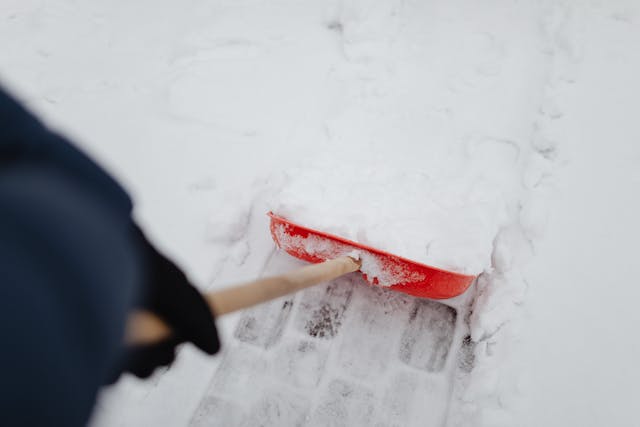 person shoveling snow