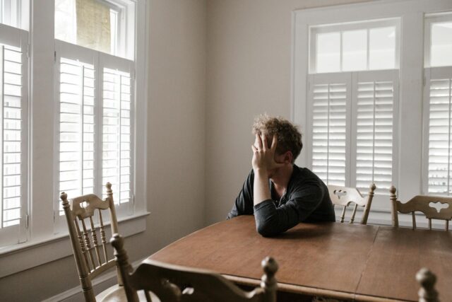 man sitting at table